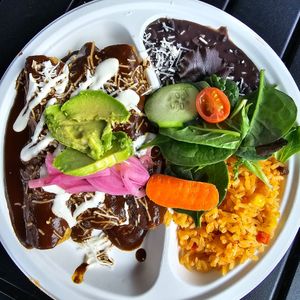 Enchilada platter with mole sauce, black beans at La Jacka Restaurant in Fresno