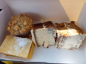 Raspberry white chocolate muffin, custard slice, coffee and walnut and a carrot cake. at Lesley's Vegan Cakes in Nottingham