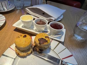 Scones with pineapple cream, chocolate and snozberry jam!  at Charlie & the Chocolate Factory Afternoon Tea in London