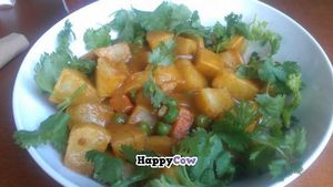 Potato curry bowl on kale at Dr. J's Vibrant Cafe in Los Angeles