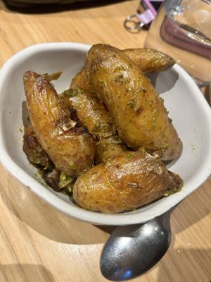 Roast Potatoes, Green Chilli Zhoug Butter  at Nomad in Surry Hills