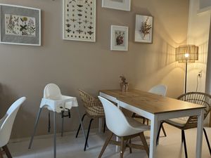 Back room with high chair  at Vlora & Vauna in Dresden