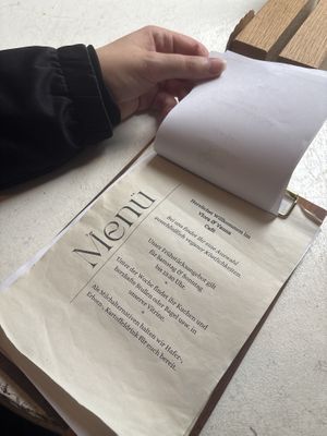 Menu at every table (you order at the cashier desk tho)  at Vlora & Vauna in Dresden