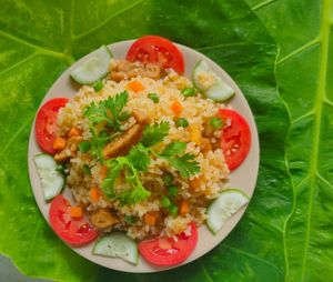 Vietnamese fried rice, or 'Cơm chiên', is a beloved dish in Vietnam. Made with jasmine rice, fresh vegetables, and protein, it's seasoned to perfection for a tasty meal. at NOW and HERE Vegetarian Buffet in Da Lat
