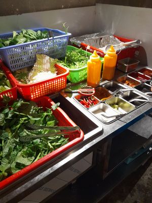 Help yourself to the condiments for your hotpot at Lẩu Chay & Coffee Nhà Nát in Ho Chi Minh City