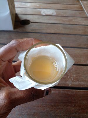 Sample glass of Nutmeg Pod juice at Belmont Estate in Belmont