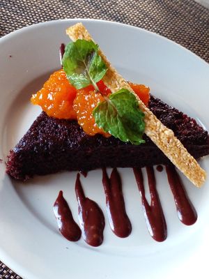 Dessert: Vegan chocolate cake with pumpkin jam and a roasted sesame stick. at Belmont Estate in Belmont