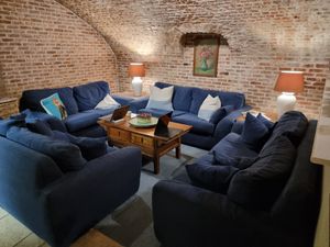 Sofas at breakfast room at Hotel Malleberg in Bruges