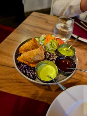 Samosa but careful, some of the dips they bring are not vegan. The red one definitely is and tastes sweet at Chakra in Tallinn