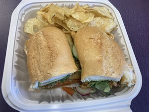 Tempeh Bahn Mi with side of chips  at Wishbone Food Shop in Richmond