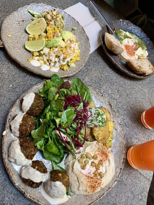 Falafel with double salad, smashed potatoes, hummus, street corn, guacamole, hummus to share   at Honest Greens in Lisbon
