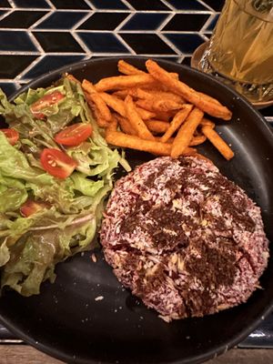 Beetroot hamburger, side salad, sweet potato fries.   at The Lunar Beach House in Chonburi