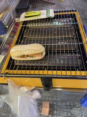 Toasting banh mi   at Banh Mi Chay Moc An  in Ho Chi Minh City