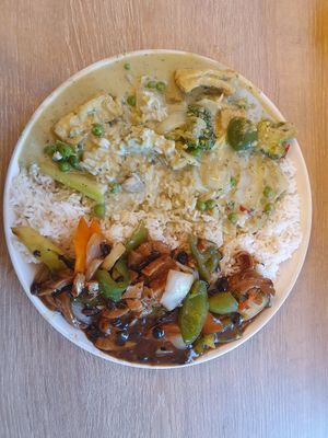 Mock chicke. with green peppers in black bean sauce. Boiled rice. Tofu in thai green sauce at Nite Nite in Wilmslow