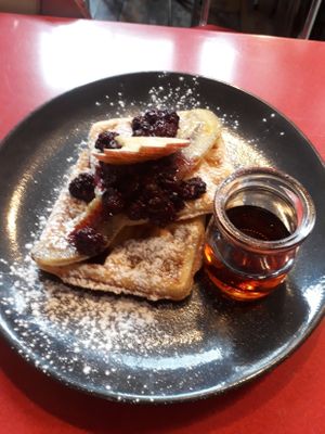 Waffles – vegan option with banana, apple, berry compote and maple syrup ($16) at Modaks Espresso in Dunedin