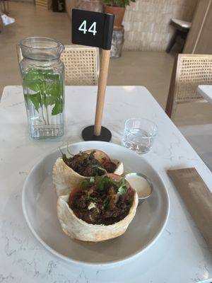 Cute table set up. Water with mint comes to your table.   at Jackie Smalls in Wayne