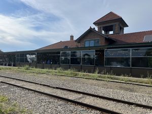 View of side/back patio area along the train tracks. Really cool atmosphere!   at The Filling Station Microbrewery in Traverse City