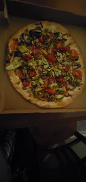 Silver Fern flatbread is hearty with veggies. Kept as no cheese although they offer vegan cheese for upcharge. at The Filling Station Microbrewery in Traverse City