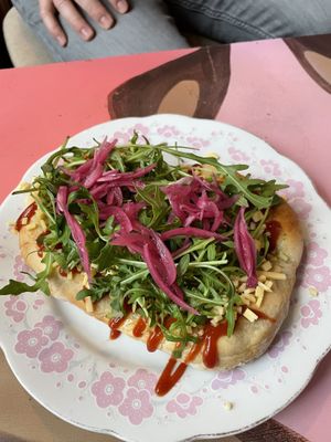 Langos with v-cheese, ketchup, arugula and pickled onion   at Safe Space in Prague