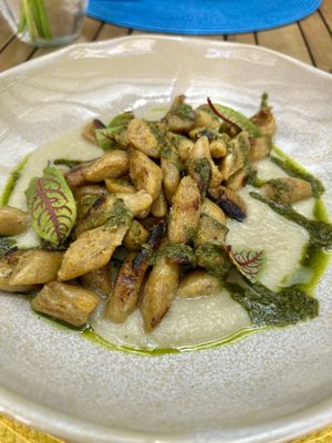 Plantain gnocchi with artichoke velouté sauce and watercress pesto  at Restaurante Cabruca in Sao Paulo