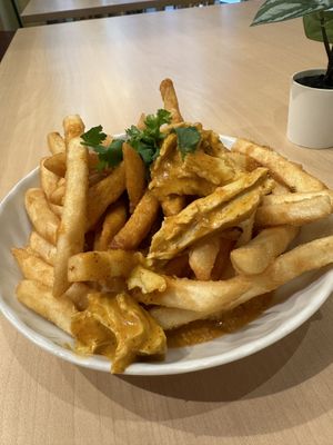 Butter chicken poutine - don’t underestimate! Very delicious!  at Saigon Lotus - Yonge in Toronto