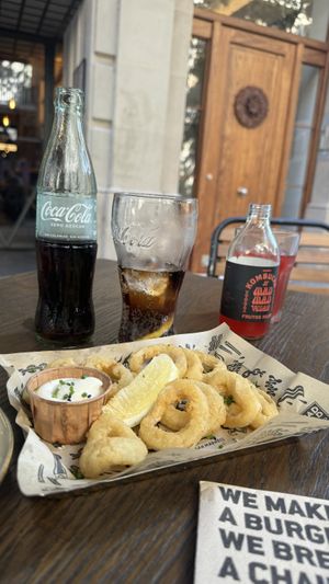 Calamari outside tables.  But if you prefer you can dine inside   at Mad Mad Vegan - Barcelona in Barcelona