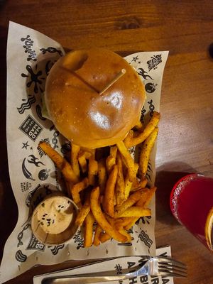 Signature Mad burger + cajun chips. Yum 🤤 at Mad Mad Vegan - Barcelona in Barcelona