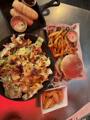Cheese sticks, special burger, and Caesar salad.   at Mad Mad Vegan - Barcelona in Barcelona