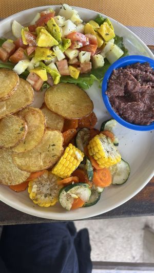 Avocado salad, beans, rasemary potatoes and mixed vegetables  at Eva's Cafe and Bar at Mango Inn in Utila