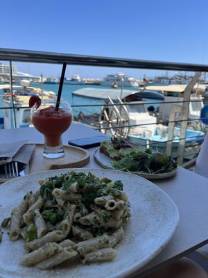 White pasta and green toast  at FRESHA in Limassol