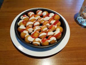 Fried potata balls with ketchup and vegan meyonaize. Crunchy outside and soft inside. Great junky side dish at Green Vege Cafe in Shanghai
