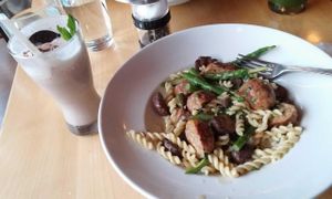 A seitan, mushroom, and asparagus pasta with a vegan mint choclate chip milkshake to indulge in. at Great Sage in Clarksville