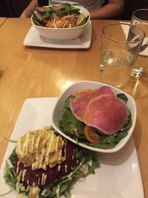 Beetroot burger topped with vegan mac and cheese. 
Served on a bed of arugula because I didn't want a bun. 
Side salad with yummy watermelon radishes.  at Great Sage in Clarksville