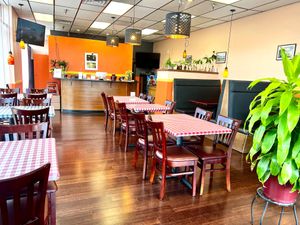 Inside, table and booth seating at Kwan Thai Cuisine in Vancouver