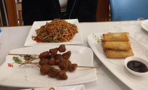 Fried noodles, spring rolls and kebab skewers.  at Huì Yuán Sù Shí Fāng 慧缘素食坊 Lotus Vegan in Shanghai