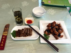 Lunch at Hui Yuan Vegetarian. Complimentary Oolong tea (and refills). Mock meat menu items. This lunch came to about 48 yuan. at Huì Yuán Sù Shí Fāng 慧缘素食坊 Lotus Vegan in Shanghai