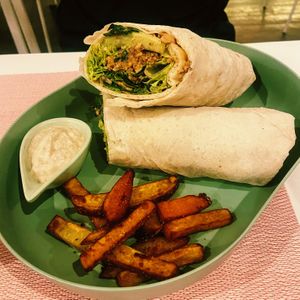 Chicken Caesar wrap with sweet potato friess  at Aubrie's Plant-Based Cuisine in El Nido