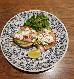 Smashed Avocado -
Vegan style feta, fresh coriander, lime, breakfast radish, sweet chilli dressing on an English breakfast muffin. at MAN - Bridgewater Exchange - T2 in Manchester