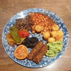 Veg Market Breakfast (vg): Vegan sausages, smashed avocado, rainbow peppers, flat mushroom, roasted tomato, tater tots and baked beans at MAN - Bridgewater Exchange - T2 in Manchester