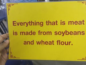 Quick sign the owner uses to explain the food  at Thai Food Vegetarian or Vegan - Maybe closed in Surat Thani