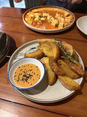 Baked potatoes - sauce not vegan but they were good by themselves   at Yen Vegan Restaurant & Bar in Sapa