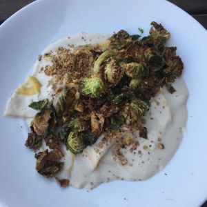 Mushroom ravioli with cashew cream sauce and Brussels sprouts. My favorite!! at Tree House in St Louis