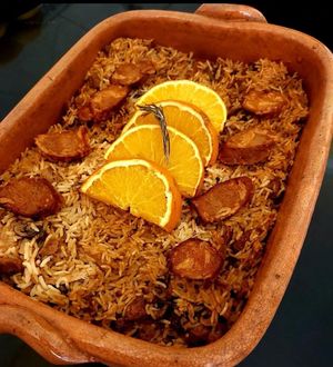 No Duck Rice. (In opposition with the traditional duck rice). Rice, a mix of mushrooms, seitan and an orange topping  at Verde Aos Pedaços in Corroios