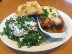 veggie lasagna and arugula salad at Stella's - Plug In in Winnipeg