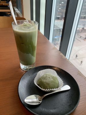 Iced matcha latte with oat milk and matcha-anko mochi.  at MUJI Ravintola in Helsinki