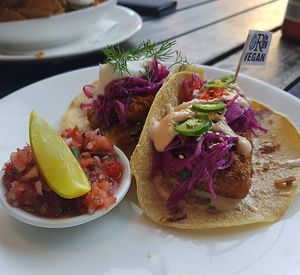 Fish taco and fried pickle taco at The Reverence Hotel in Footscray