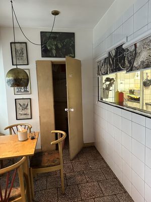Bathroom and see through kitchen  at Gotuyam Local in Poznan