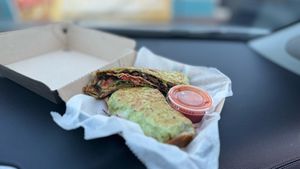 Shroom Crunch Wrap
A crispy grilled tortilla filled with mushrooms, onions, peppers, spinach, salsa, and cilantro lime with a crunch tortilla in the middle. Served with hot sauce. at Shroomlicious Meals in Memphis