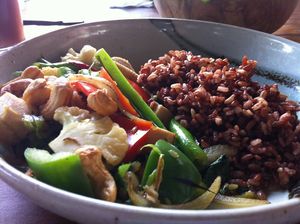 Cashew Ginger Tofu (tofu, greens sautéed in aromatic spices and it comes with red rice)
 at The Garden Kafe at The Yoga Barn in Ubud