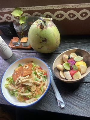 Vegan Caesar salad, small fruit salad and cold coconut   at The Garden Kafe at The Yoga Barn in Ubud